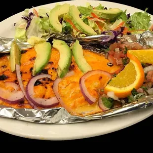 a plate of fish and vegetables