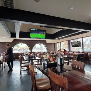 people sitting at tables in a restaurant