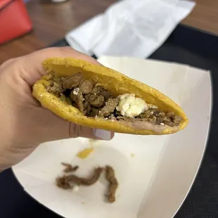 Gordita de asada with beans and cheese