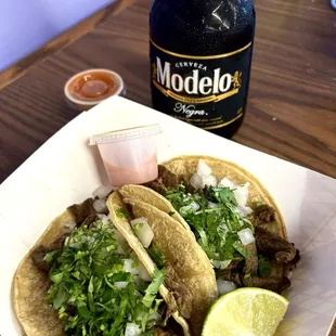 Tacos de asada and a cold modelo