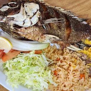 a plate of fish and rice