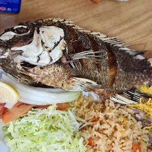 a plate of fish and rice