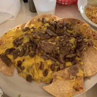 Ponchos with beans, cheese and fajita.