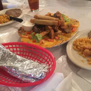 Botana for 2, half chicken half beef. Yum! Comes with side of rice and beans and ginormous flour tortillas.