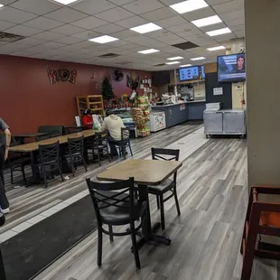 a restaurant with tables and chairs