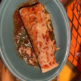 a plate of enchiladas with sauce
