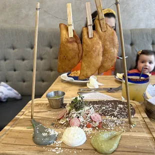 Empanadas, yummy and beautiful presentation, our daughter couldn&apos;t stop staring. Also pictured; the very refreshing house Margarita.