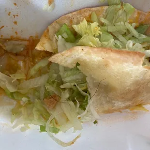 a close up of a sandwich in a styrofoam container