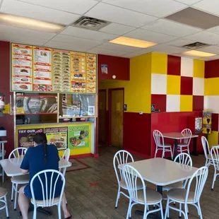 Restaurant with half the lights burned out.