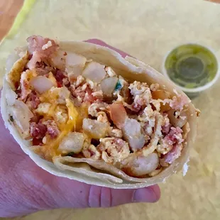 Tomato and onion burrito add bacon. Delicious!