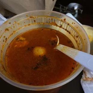 a bowl of soup with a spoon in it