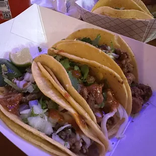 three tacos on a tray