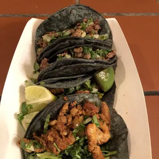 Asada and pastor tacos, in blue corn tortillas