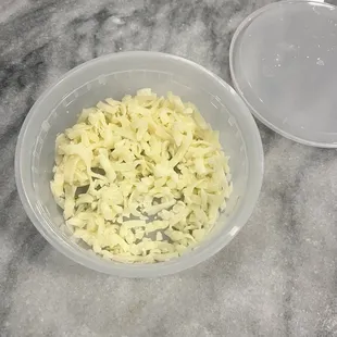 Ordered small queso to go - got home &amp; had a container of shredded cheese!