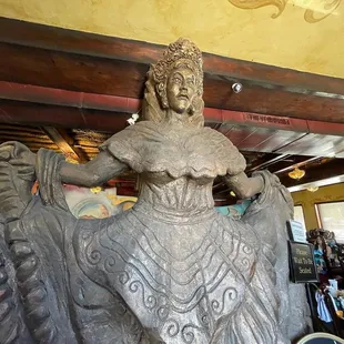 a statue of a woman riding a horse