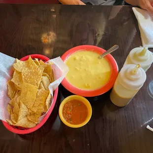 Triple threat salsas, chips and Queso