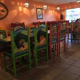 Carved chairs! Also carved table tops with lucite sheets.