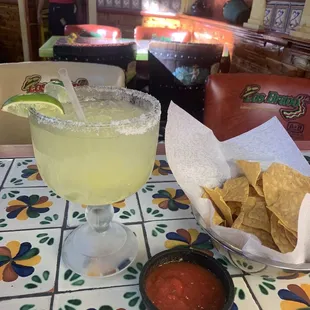 Chips and salsa and the jumbo lime margarita on the rocks.