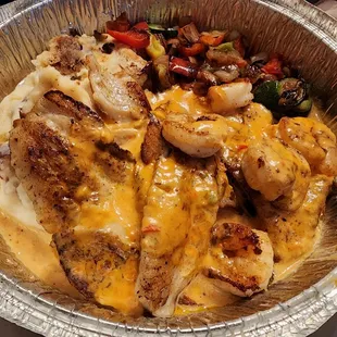 Pescado Gringo: 2 fish fillets, shrimp, onions, bell peppers, zucchini, squash; served with smash potatoes &amp; chipotle sauce