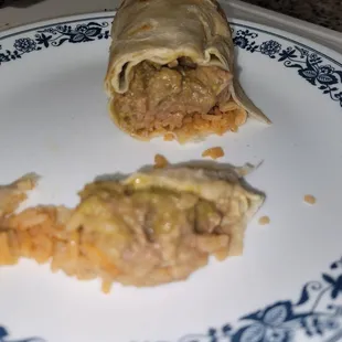 Cross section of whats left of my Chile verde super burrito for $10.99. Guacamole n sour cream not pictured