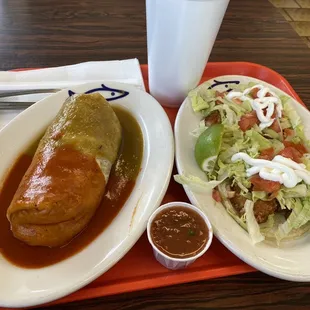 Burrito  of carne asada! With sauce on top, and 2 tacos of shrimp  with lettuce and tomato &amp; sour cream, with lime!