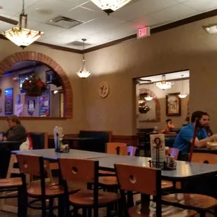 people sitting at tables in a restaurant