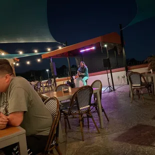 a man sitting at a table in a restaurant
