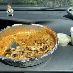 The cup of queso for the pollo con queso is in a ketchup cup. A small one.