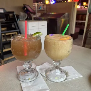 Left side- tamarind margarita straight on rock.  Right side-- banana margarita blended