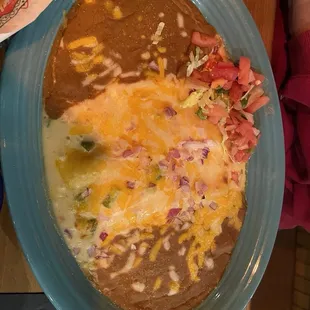 Cheese enchiladas with rice and refried beans