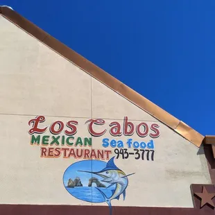 If you decide you want to eat here, look for this wedged roof and this logo.  (Look at the incredible sky that day.)