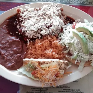 This platter I had between lunch and dinner was good and filling.  It was 3 items with rice and refried beans.