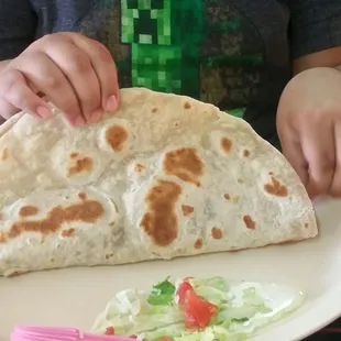 My 10 year old ordered 2 fajita tacos.  Our server recommended one.  Now I see why.  Everything is bigger in Texas.