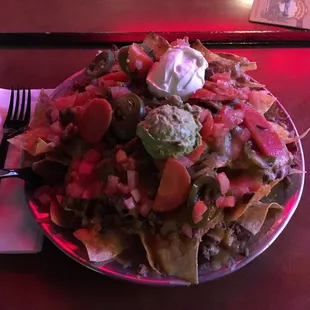 Carne Asada nachos (regular size) $13.  Huge shareable platter.