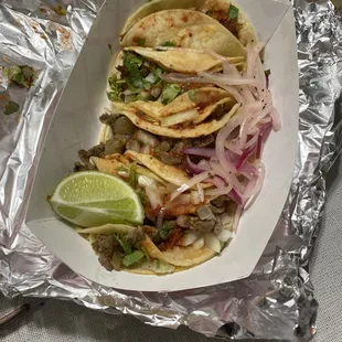 2 carnitas tacos and 2 asada tacos. Those PICKLED ONIONS, though... out of this world.