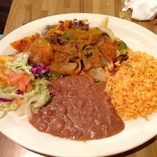 Campesinos special - Mexican style beef with side of beans, rice, and salad