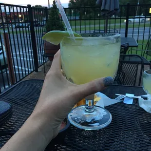 a person holding a drink