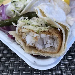 Inside look at Baja Fish Taco. Big flakey fish in beer batter.