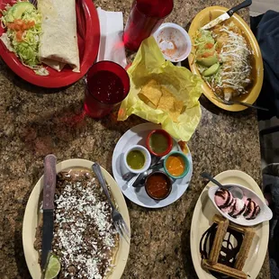 Beef burrito, loaded chicken burrito, beef huarache, and churros w/ ice cream