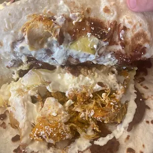 Baleada with chicken, avocado, cheese, beans