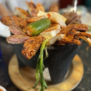 Artistic photo of the Molcajete trying to match the delight of this presentation.