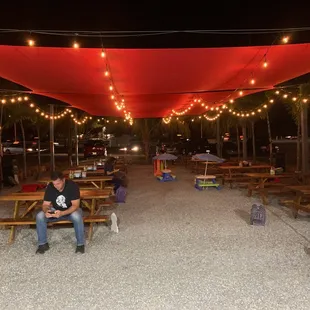 a man sitting on a picnic table