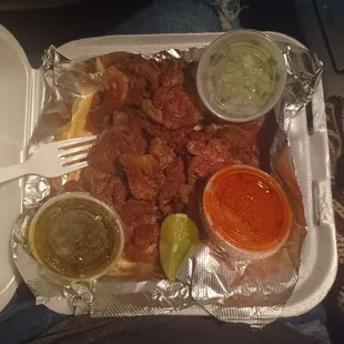 Well serve plate of Machitos with 5 corn tortillas, 1 red and green salsa and chopped onion. It was delicious.