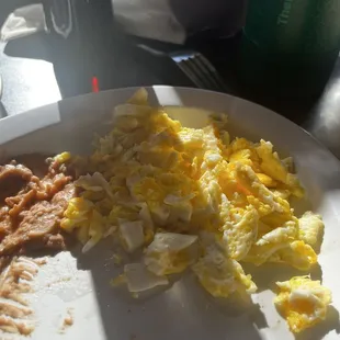 Scrambled Two Eggs with Bacon, beans and potato. Did not eat eg because seems like they don't know how to scramble.