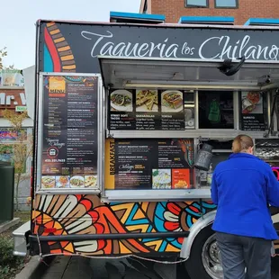  man standing in front of a food truck