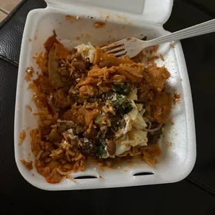 A lot of rice, mixed around to find more beans or meat.