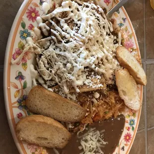 Chilaquiles with salsa roja and shredded chicken!