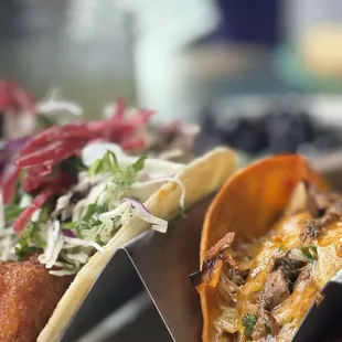 two tacos on a table