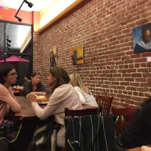 a group of people eating at a restaurant