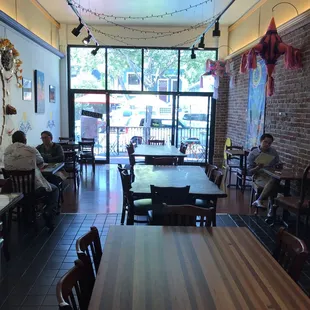 people sitting at tables in a restaurant